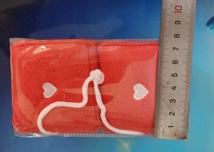 Measurement of red plush dice car charms with white hearts showing 8cm width dimensions