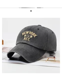 Detailed embroidery on grey washed cotton baseball cap with New York vintage lettering