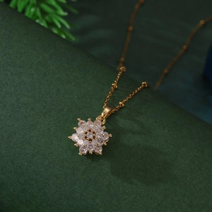 Golden rotating snowflake pendant necklace with sparkling zircons for Christmas jewelry