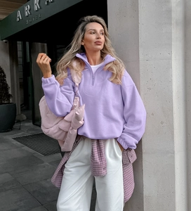 Close-up of lavender purple fleece hoodie with silver zipper and soft warm texture