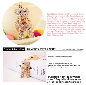 Detailed macro view of a gold-toned articulated teddy bear keychain with white rhinestones
