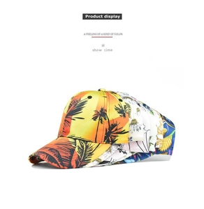Detailed view of printed baseball caps with tropical sunset and floral patterns