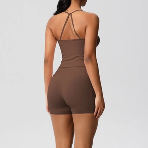 Rear view of brown two-piece yoga set with strappy back tank top and high waist shorts