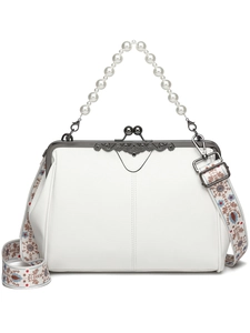 Detail view of white textured leather bag with pearl handle and floral embroidered strap