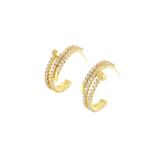 Golden nail-shaped stud earrings featuring pavé micro-set cubic zirconia in a half-hoop design