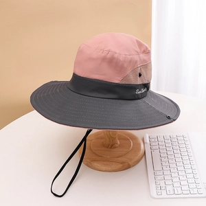 Detail view of the wide-brim sun hat with mesh vents and adjustable wind rope