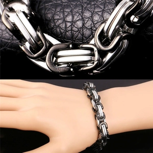Detail of silver and black Byzantine chain bracelet in stainless steel on wrist