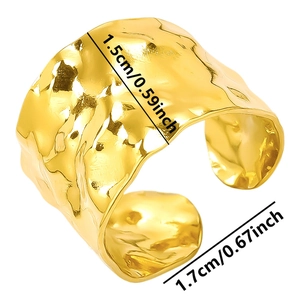 Detailed view of wide textured gold ring with 1.5cm width and 1.7cm inner diameter