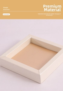 Detail of a square cream PU jewelry display tray with a soft tan inner lining
