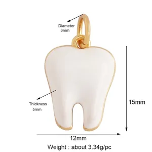 White enamel tooth pendant with gold metal edges and detailed dimensions of 15x12mm