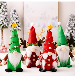 Detailed view of handmade Christmas gnomes with reindeer antlers and tree hats