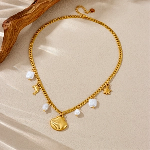Gold ocean necklace with dolphin shell turtle pendants and white baroque pearls