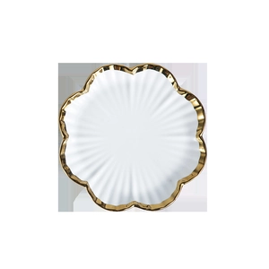 Nordic white flower-shaped ceramic plate with gold rim and radial texture for steak