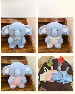 Detail showing the light blue plush elephant doll with various color overall outfits