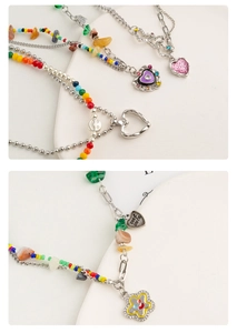 Detailed macro view of colorful dopamine beads and Y2K heart pendants on silver chains