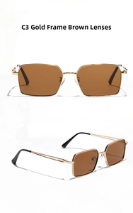 Macro detail of gold metal frame sunglasses with textured engraving and brown lenses