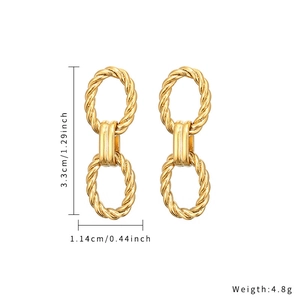 Detailed view of gold twisted oval earrings with height and width measurements