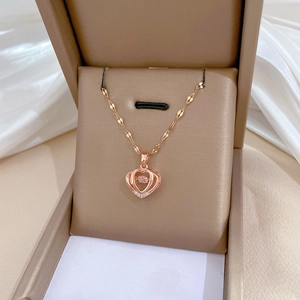 Elegant rose gold double heart necklace with sparkling diamonds on a silk display