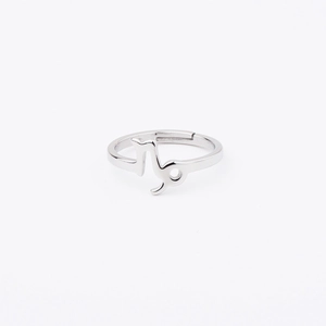 Detailed view of silver Capricorn zodiac sign engraving on adjustable stainless steel ring