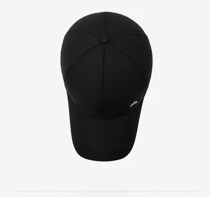 Top view of black winter baseball cap showing premium twill cotton texture and metal logo