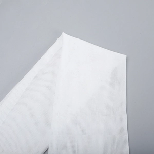 Close-up of white mesh fabric texture with delicate grid pattern on bodycon dress