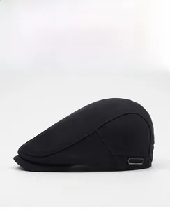 Side view of black ivy cap showing breathable knit texture and metal plate detail