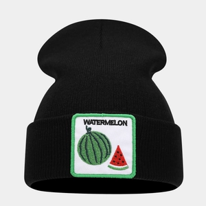 Detailed view of black knitted beanie featuring a square watermelon embroidery patch