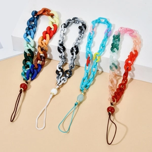 Detail view of colorful resin acrylic chunky chain lanyards with marble patterns