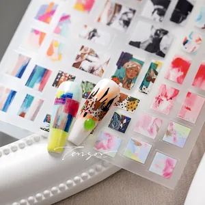 Detailed macro view of artistic ultra-thin nail stickers with abstract graffiti and portrait designs