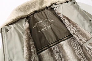 Detail view of winter jacket featuring plush faux fur collar and warm fleece lining