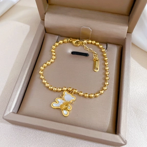 Elegant gold titanium steel bracelet with mother-of-pearl bear and Love heart charms