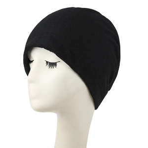 Classic black knitted beanie with ribbed texture on a white head mannequin for a snug fit