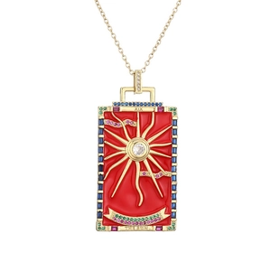 Gold Tarot The Sun necklace with red enamel and colorful zircon stones on white background