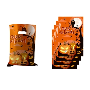 Stack of orange Halloween gift bags with pumpkin and ghost silhouette designs