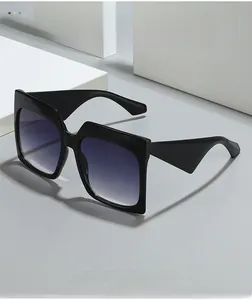 Square black sunglasses with purple gradient lenses on white geometric stone podium