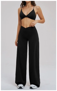 Detail of black cross waist yoga set featuring V-neck tank top and wide leg pants