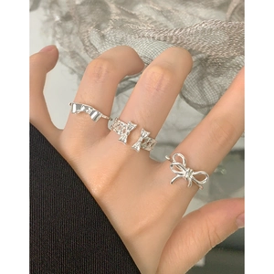 Elegant S925 sterling silver bow rings for women featuring minimalist hollowed design