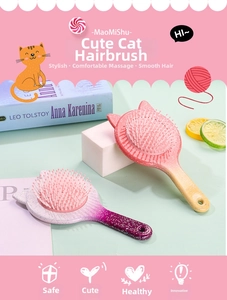 Detail of glitter handles and round-tip bristles on cat-ear massage hairbrushes