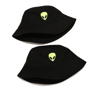 Streetwear black cotton bucket hat with neon green alien embroidery on white background