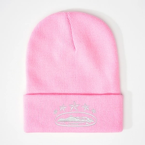Detailed view of the star embroidery and ribbed knit texture on this pink beanie