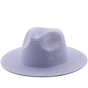 Macro shot of fine woven texture and structured brim on lavender summer fedora straw hat