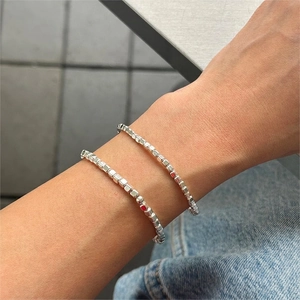 Minimalist S925 sterling silver beaded bracelet set shown on model wrist in daily setting