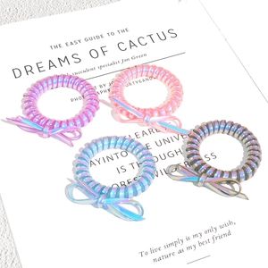 Lot d'élastiques spirales holographiques avec nœuds en rose, violet, bleu et argent