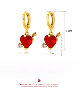 Detail of Cupid heart drop earrings featuring red crystal and golden arrow design
