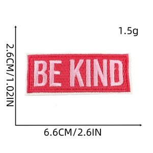 Detailed view of pink Be Kind embroidered patch with precise size measurements