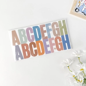 Detail of colorful 2.5 inch waterproof alphabet stickers A-H with matte finish decoration