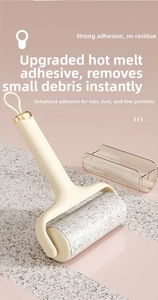 Detail of sticky lint roller with ergonomic cream handle and clear protective cover