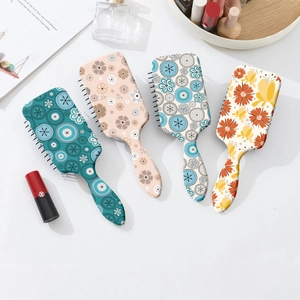 Floral air cushion hair brushes with scalp massage pins in four colorful patterns