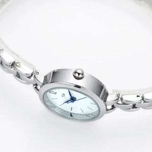 Minimalist silver women's watch with white dial, blue hands and metal chain strap