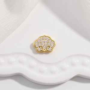 Detailed macro of a gold S925 silver Ruyi lock pendant inlaid with sparkling zircon stones